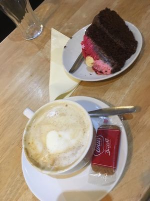 chocolate fudge cake and latte  at PerryLicious Coffee and Cake Rooms in Teignmouth