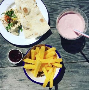 houmous, home made flatbread, polenta chips, beetroot ketchup and strawberry/coconut smoothie at gud in Altrincham