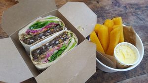 Yummy black bean burger with polenta chips at gud in Altrincham