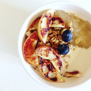 Porridge with fresh fruit, fruit compote & oat cream at gud in Altrincham