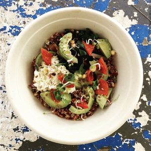 Breakfast bowl: Rice & quinoa, avocado, tofu labneh, roasted tomatoes at gud in Altrincham
