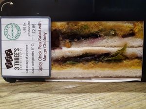 Spicy chickpea salad with mango chutney sandwich (£2.85). at 3 Three's Coffee Lounge in Birmingham