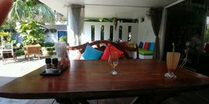 outside seating with pool view at Greenlight Cafe & Bar in Koh Samui