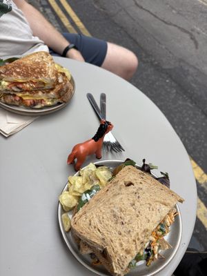 Chaat sandwich for me, vegan toasty #2 for my partner. Cute little animals for table numbers!  at Shed in Reading