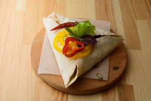 Enchilada whith soy meat & chocolate souse Mochi at One Planet in Kyiv