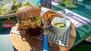 Vegan burger with hummus and homemade fries at Die Röhre in Unterach Am Attersee