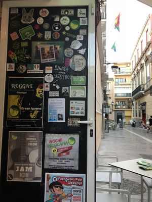 Door and street  at Green Iguana Bar in Malaga