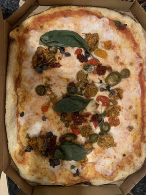 Aubergine “meatball” pizza with vegan cheese   at Zizzi in Wokingham