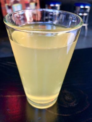 Piña Hard kombucha: Inside of Emporium video game bar, where La vénganza kitchen is.   at Taqueria La Venganza in Oakland