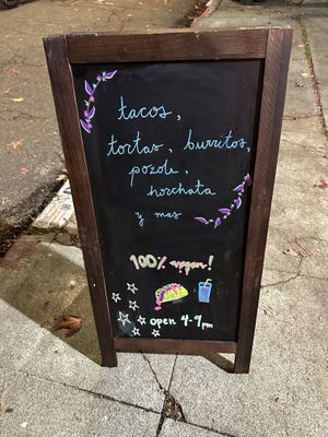 Sign out front  at Taqueria La Venganza in Oakland