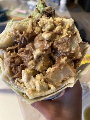 Breakfast burrito with asada and guaccamole  at Taqueria La Venganza in Oakland