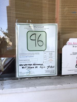 Food safety inspection rating posted in front window at New Eritrea in San Francisco