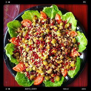 Vegan catering tray of roasted brussel sprouts fresh pomegranate. at HANDHELDZ in Bethlehem