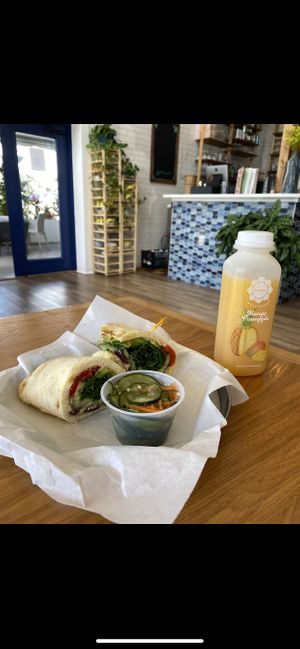 avocado naanwich, mango pineapple juice, cucumber salad  at Karma Juice Bar and Eatery in St Petersburg