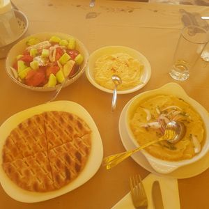 Sorry for the weird yellow light - I was under a sun canopy! Pitta, fava, houmous and tomato and cucumber salad at Sirtaki Taverna in Rhodes