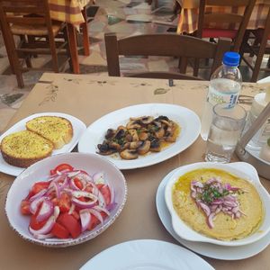Garlic bread, garlic mushrooms, tomato salad and fava at Sirtaki Taverna in Rhodes