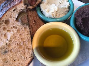 Toast sampler with rosemary white bean spread, chocolate hazelnut spread and olive oil at Tabor Bread in Portland