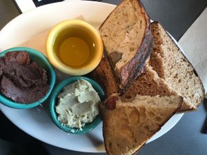 Toast sampler with rosemary white bean spread, chocolate hazelnut spread and olive oil at Tabor Bread in Portland