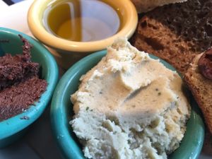 Toast sampler with rosemary white bean spread, chocolate hazelnut spread and olive oil at Tabor Bread in Portland