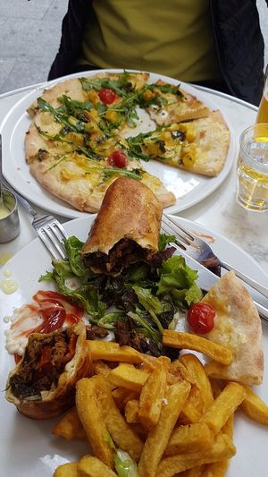 Kabab sandwhich and pizza at Janine Loves Sunday in Paris