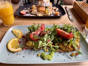 Waffle with fresh fruit; Oderberger Straße (scrambled tofu on bread)  at Cafe Neue Liebe in Berlin