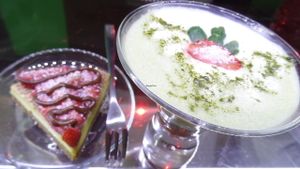 Matcha tea with almond milk and raw cake. at Bio & Chocolate in Siena