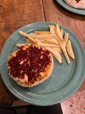 Pizza burger with fries at Vegarum in Monterrey