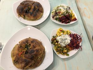 Side salad + spinach veggie pie  at Kiez Vegan - Warschauer Str in Berlin