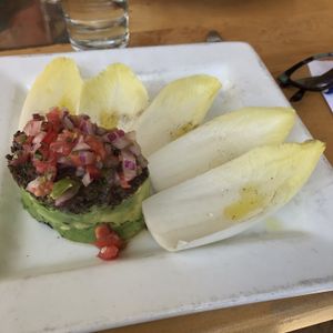 chopped mushrooms, tomatoes, red onions and sliced avocado that you scoop up with leaves of endive at Leaf Vegetarian Restaurant in Boulder