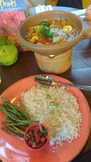 Brazilian Moqueca de Palmitos with rice, green beans and salsa at Las Iguanas - Quayside in Newcastle Upon Tyne