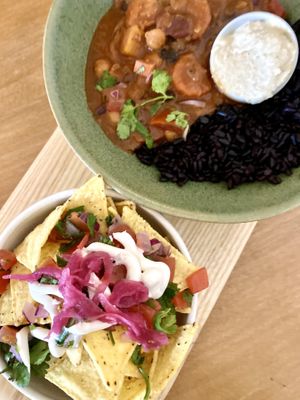 Chilli bowl with black rice and cashew cream… yum! And posh nacos 💕  at Earthlings in Bolton