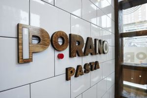 The logo of the restaurant near the front of the store. at Porano Pasta in St Louis