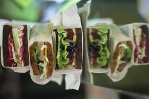 Tofu sandwich with beetroot hummus, rucola and mustard sauce (vegetarian)         
Sandwich with seitan sausage, spinach and cucumber  (vegetarian)                            
 at Ra.man in Kyiv