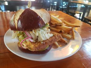 Vegan fried tofu sandwich with fries at Guglhupf in Durham