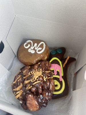 Vegan Maple Cream and VooDoo doll (other one isn’t vegan).  at Voodoo Doughnut - E Colfax in Denver