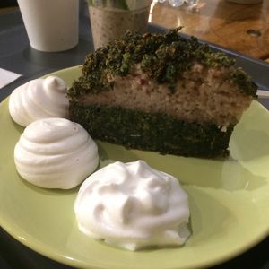 Cake with whipped cream and sugar puffs at Farma Burgerownia Roslinna in Krakow