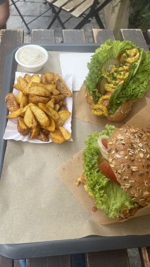Sloppy farmer burger & soj-dog. Looks good but underwhelmed with flavour.   at Farma Burgerownia Roslinna in Krakow