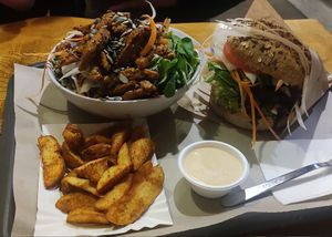 Gyros salad and Bauer burger with fries at Farma Burgerownia Roslinna in Krakow