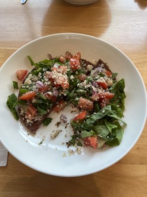 Half eaten pizzaa  at Glow Juicery in Duncan