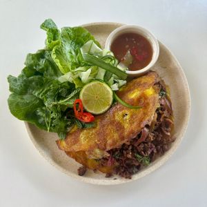 Vietnamese pancake. Delicious but hard to eat, especially when sharing  at Greenhouse Canteen & Bar in Tallebudgera-vallley