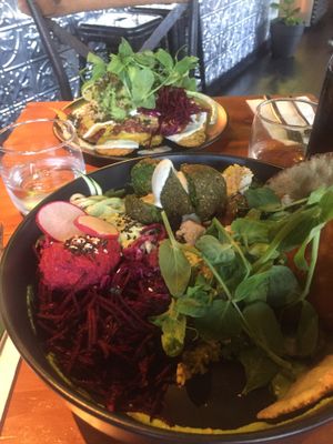 Nachos in the back and plant bowl in the front at Greenhouse Canteen & Bar in Tallebudgera-vallley