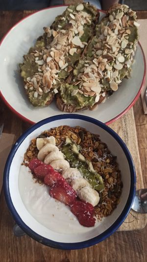 Avocado Toast and vegan granola Bowl at Pum Pum Cafe in Madrid
