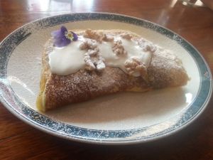 Vegan banana and walnut pancakes with cream and maple syrup at CassellBella's Bakery Cafe in Northcote