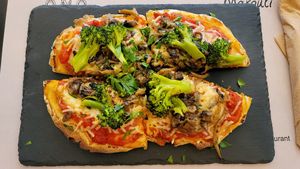 Pinsa: tomato sauce, vegan mozzarella, mushroom and broccoli 🔥 at ONO by Marouli in Rhodes