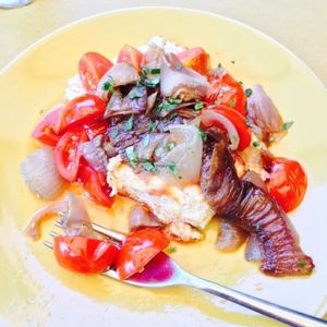 Baked feta with caramelised onions & cherry tomatoes at ONO by Marouli in Rhodes