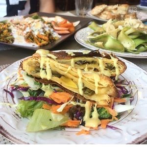Pie with vegetables and salad, Indian lentil stew, amazing raw zucchini salad at ONO by Marouli in Rhodes