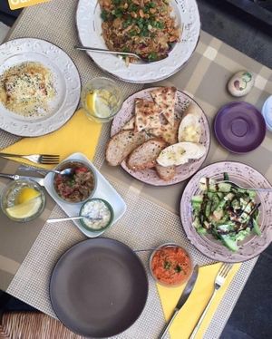 Fried rice, raw zucchini salad, baked feta cheese, bread and dipping sauces at ONO by Marouli in Rhodes