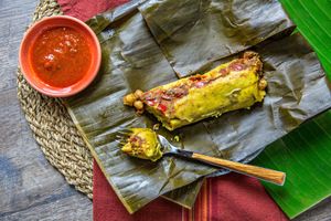 Tamales in four varieties: smoky pinto beans & plantains, sriracha braised lentils, chickpeas with bell peppers & eggplant and black beans, spinach & olives at Soul Cocina in Durham