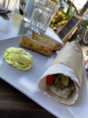 Wrap with herb and spearmint patties. Tiny bit dry but still good. at Veganaki in Athens