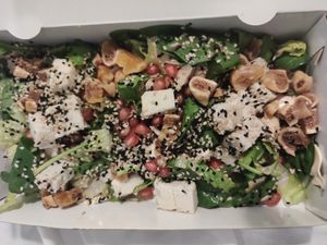 Salad with cashew feta, dried figs, mushrooms, tomatoes, pomegranate seeds, poppy seeds.  at Veganaki in Athens